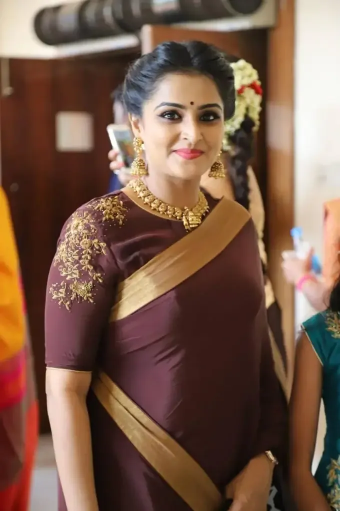 Actress Remya Nambeeshan In Traditional Maroon Saree